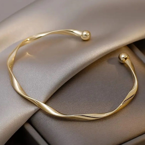 Jewelry - Elegant Gold-Tone Twisted Bangle Bracelet